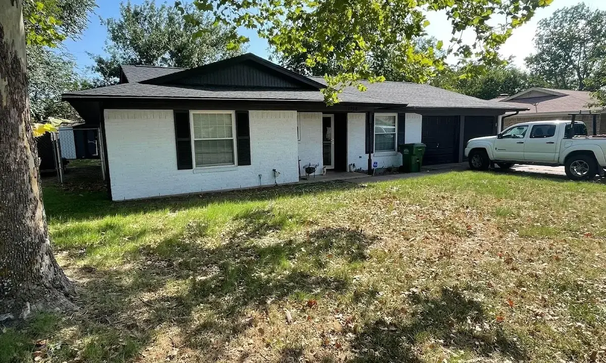 Professional roofing crew working on a residential roof in Cedar Mill